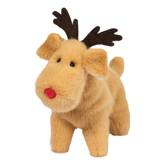 This is Reindeer Dog by Douglas Cuddle Toys. Small dog with beige fur that is short to medium in length, straight and with a soft low sheen. The muzzle is beige and rounded, with a small round red nose. The eyes are small and black. The ears are beige, floppy and rounded at the tips with lighter inner ear visible. The legs and paws are beige and proportionate, the tail is short and beige. Two flat, dark brown antlers rise from the head. The plush stands on all four legs in a fixed standing pose. The fa...