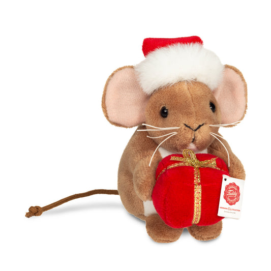 This is Small Christmas Mouse With Present by Teddy-Hermann. Small brown mouse sitting upright holding a present. The fur is brown, short, smooth and with a slight sheen; the tummy is white and the inner ears are pink. Eyes are black and round. Nose is black and small and triangular. Whiskers are white and long. Ears are large and rounded, matching the brown fur at the outer ear. Paws are brown and match the fur; paw pads are not visible. A long thin brown tail extends behind. The mouse wears a red San...