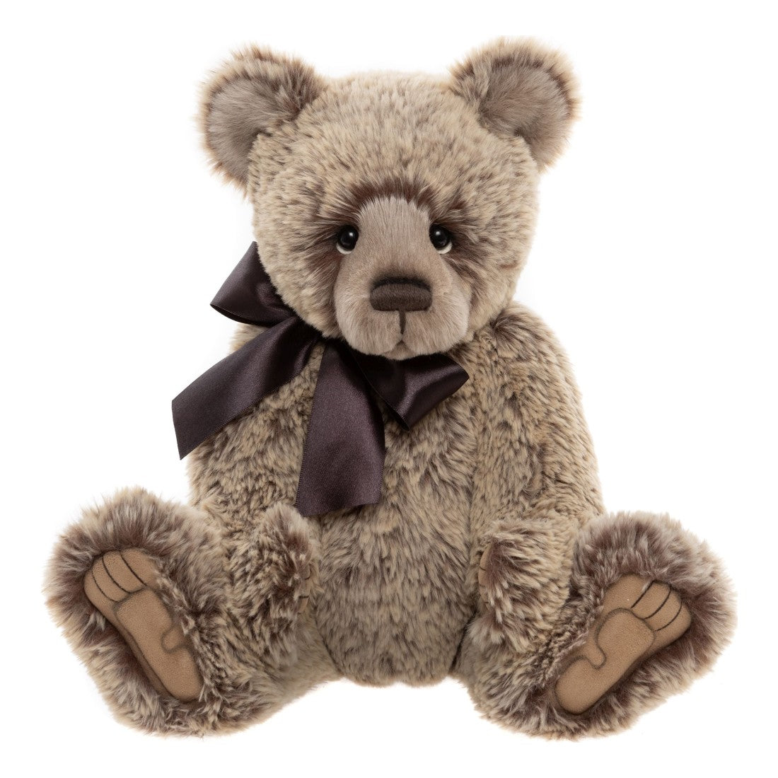 This is Davey by Charlie Bears. Sitting fully jointed teddy with medium-length, slightly waved fur that has a soft sheen. The fur is predominantly beige with darker brown spotting and brown highlights around the eyes; the fur appears dense and plush. The muzzle is a lighter beige, the inner ears are beige with brown edges, the tummy and main body fur are beige with brown speckling, and the paws have beige fur with tan brown paw pads visible. Eyes are black and round; the nose is brown and oval with a s...
